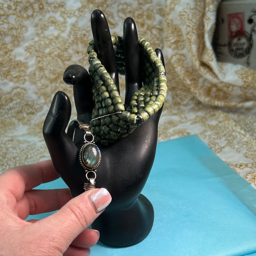 Green Beaded Bracelet with Silver Pendant